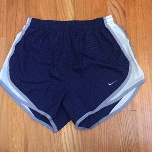 Dark and light purple patterned Nike shorts.